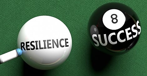 Resilience brings success - pictured as word Resilience on a pool ball, to symbo