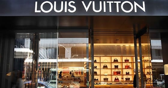 KYOTO, JAPAN - APRIL 17: Shoppers visit Louis Vuitton store on April 17, 2012 in