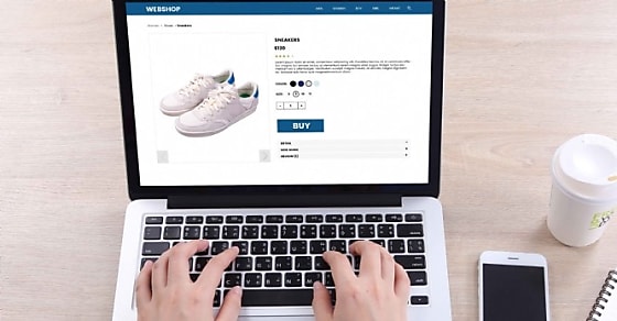 Top view business woman buying sneakers on ecommerce website with smart phone an