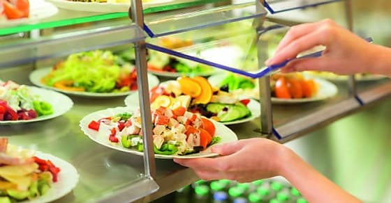 Fresh salad buffet self-service food display human hand take plate