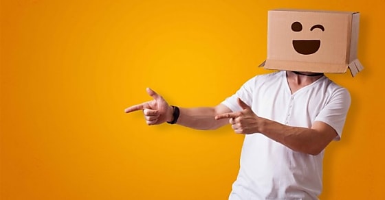 Funny man wearing cardboard box on his head with smiley face